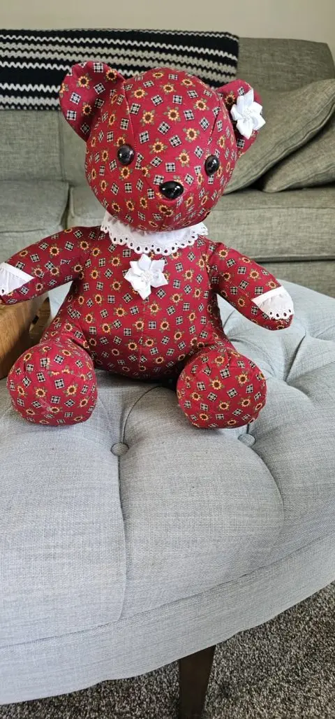 Handmade custom memory bear sewn from meaningful red patterned fabric